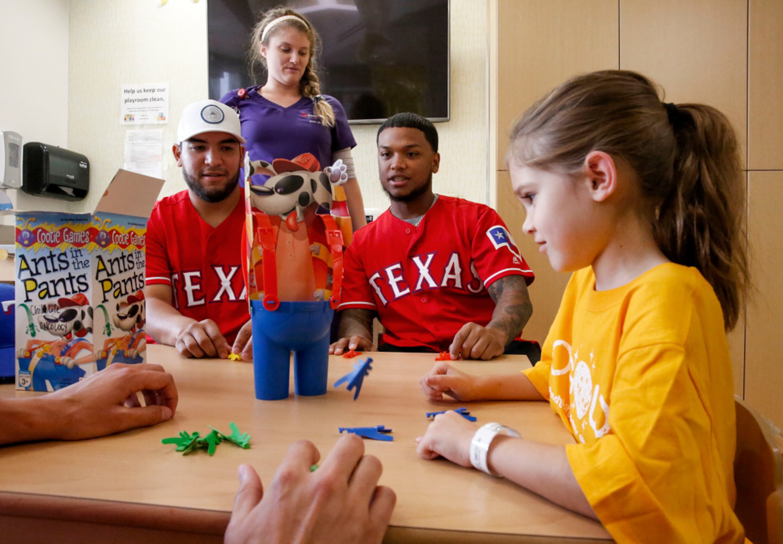 Texas Rangers catcher Jose Trevino, left and outfielder Willie Calhoun play Ants in the...