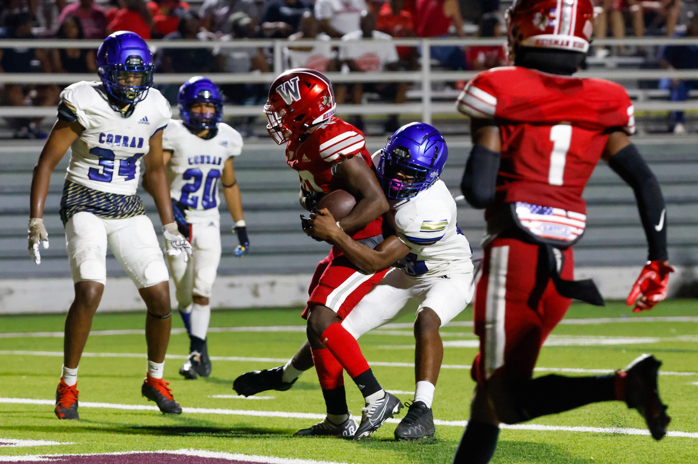 Woodrow Wilson wide receiver Jamel Tony-Black (10) crosses into the end zone for a touch...