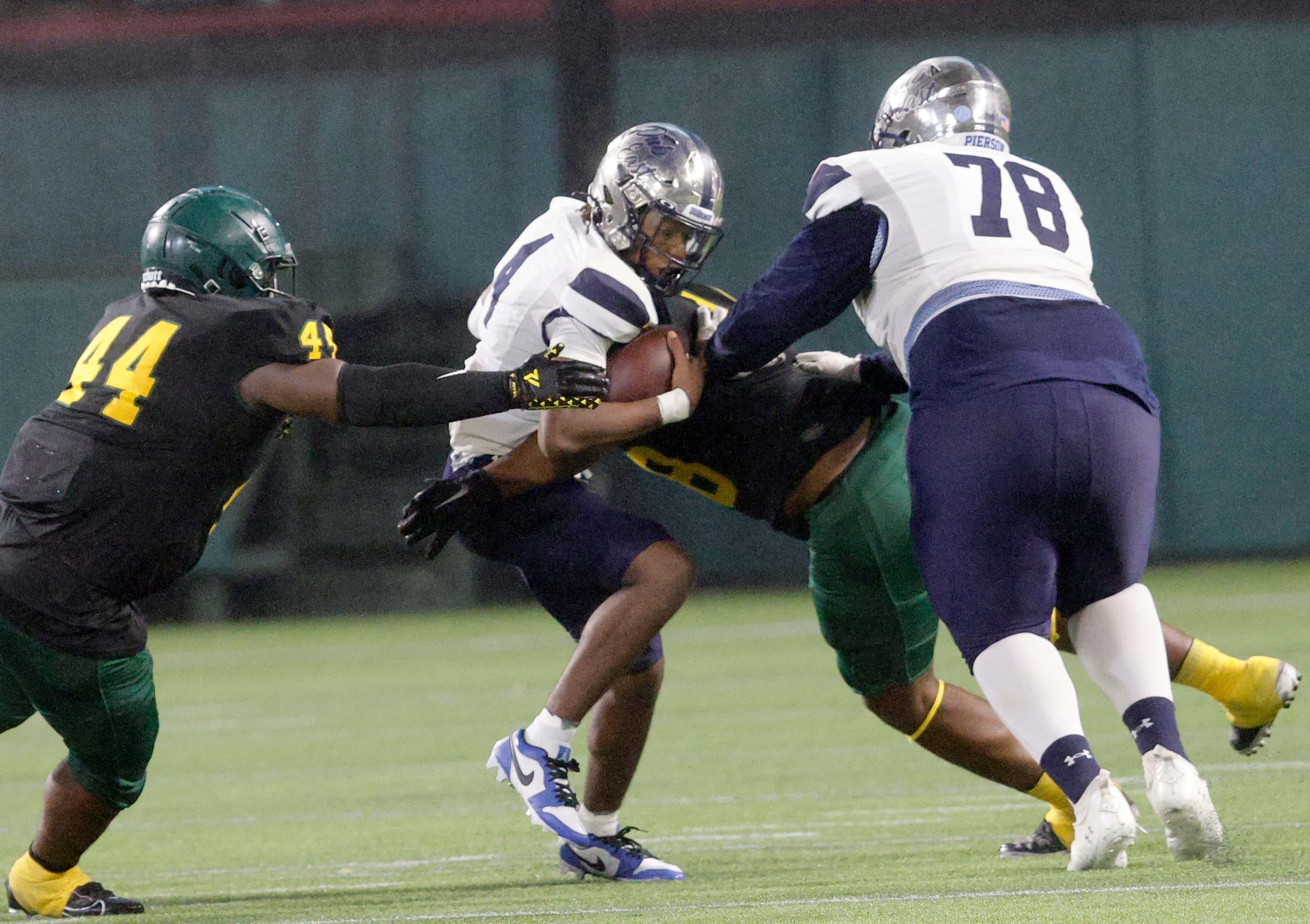 Wylie East's quarterback Howard Fisher (4) is sacked by DeSoto's Jason Douglas (48), behind,...
