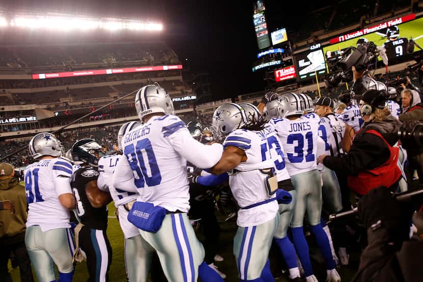 Dallas Cowboys and Philadelphia Eagles players get in a scuffle before the game at Lincoln...
