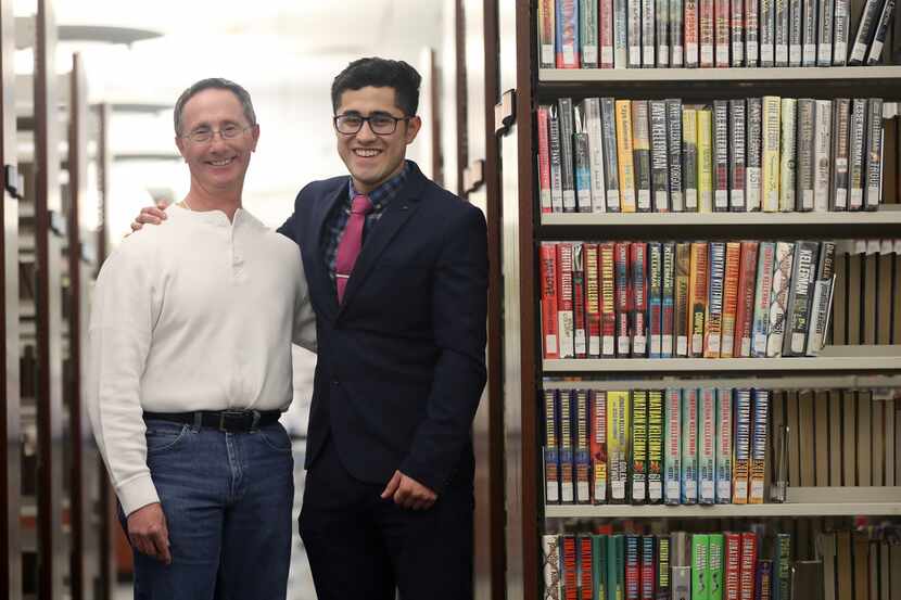 Alfred Hersh, left, and Luis Ruiz pose at the public library in Carrollton, Texas, Saturday,...