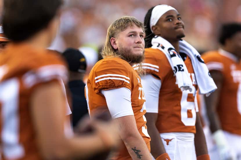Texas quarterback Quinn Ewers (3) stands on the sideline during the first half of the team's...
