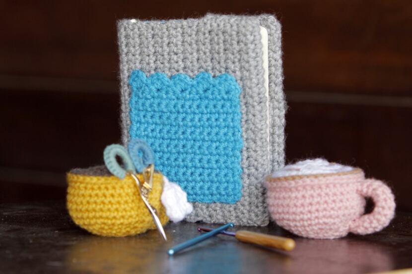 Items the that Meredith Crawford has crocheted and knitted are coffee cups, a cover for her...