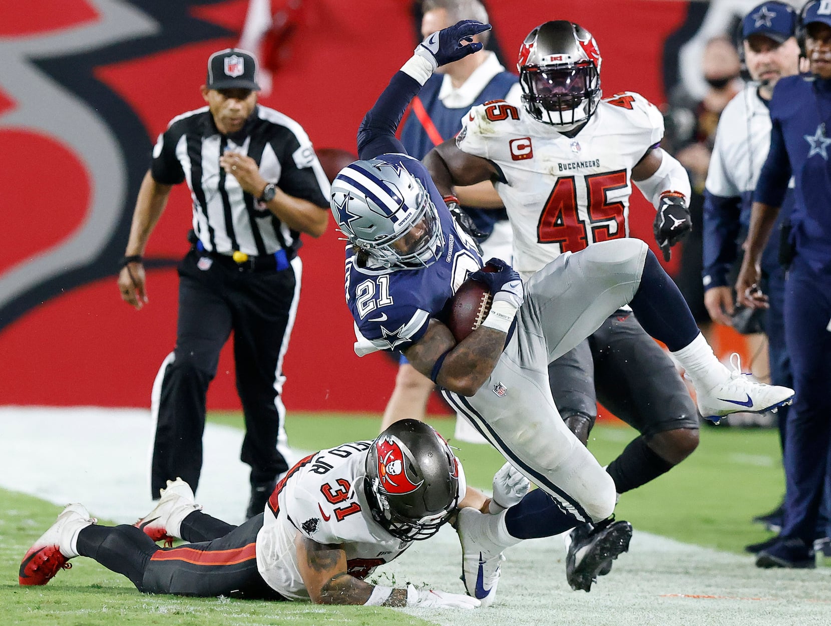 Tampa Bay Buccaneers safety Antoine Winfield Jr., left, knocks the