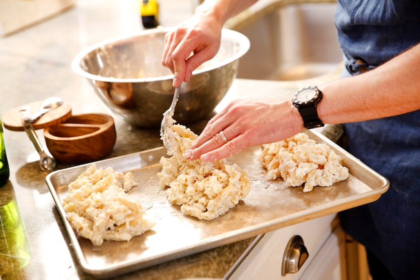 Restaurant owner and chef Julian Barsotti divides the penne-bechamel mixture into three...