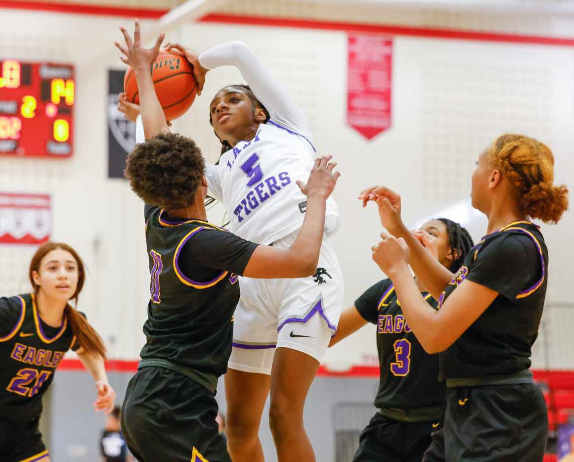 Lincoln freshman Ar’Jayla Elder (5) takes control of a rebound during a game against...