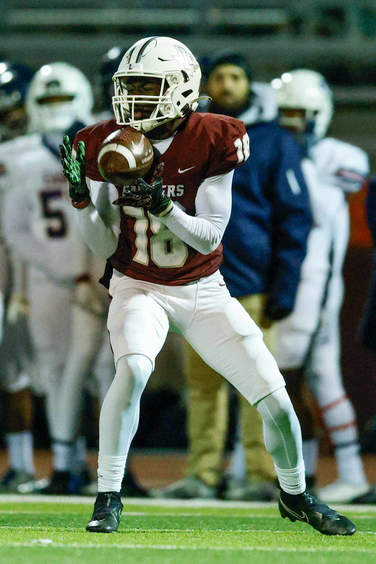 Lewisville wide receiver Tye Miller (18) catches a pass during the first half of a Class 6A...