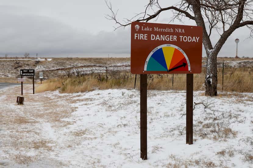 A sign shows an extreme fire danger today near Lake Meredith National Recreation Area,...