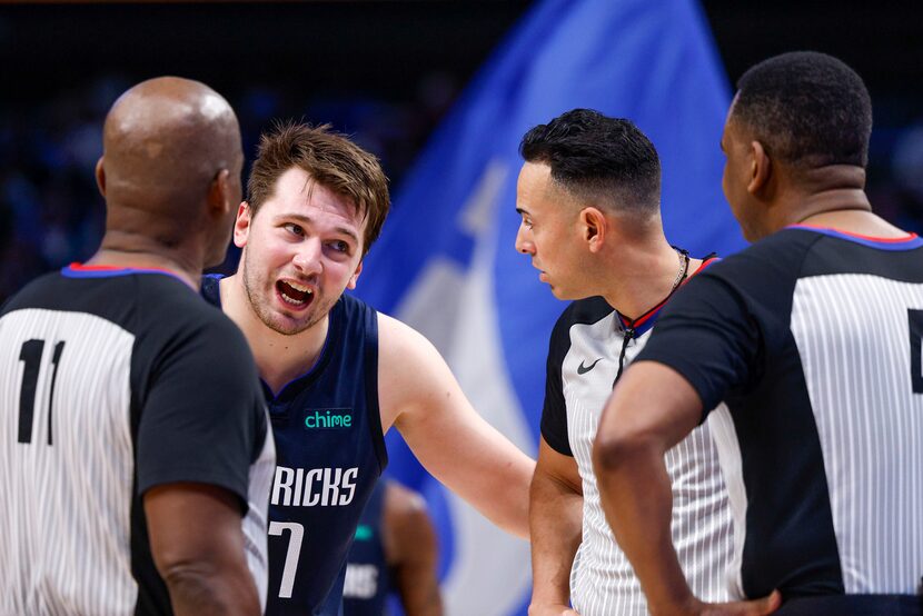 Dallas Mavericks guard Luka Doncic (77) talks with the referees during the fourth quarter of...