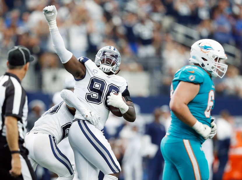 Dallas Cowboys defensive end Demarcus Lawrence (90) celebrates with Dallas Cowboys defensive...