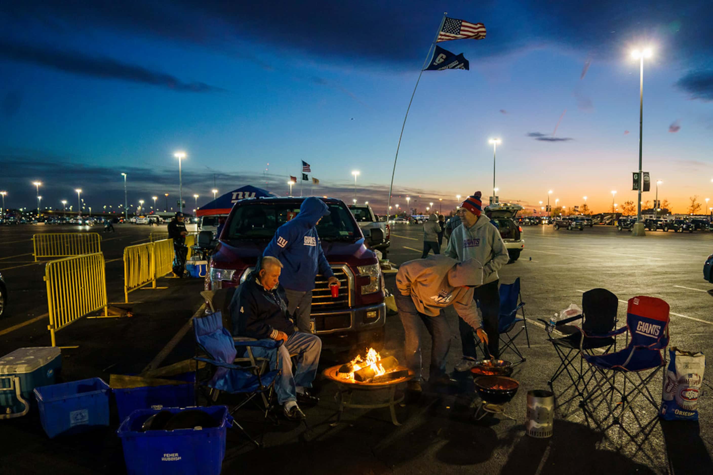 New York Giants fans tailgate before a Monday Night Football game between the Dallas Cowboys...