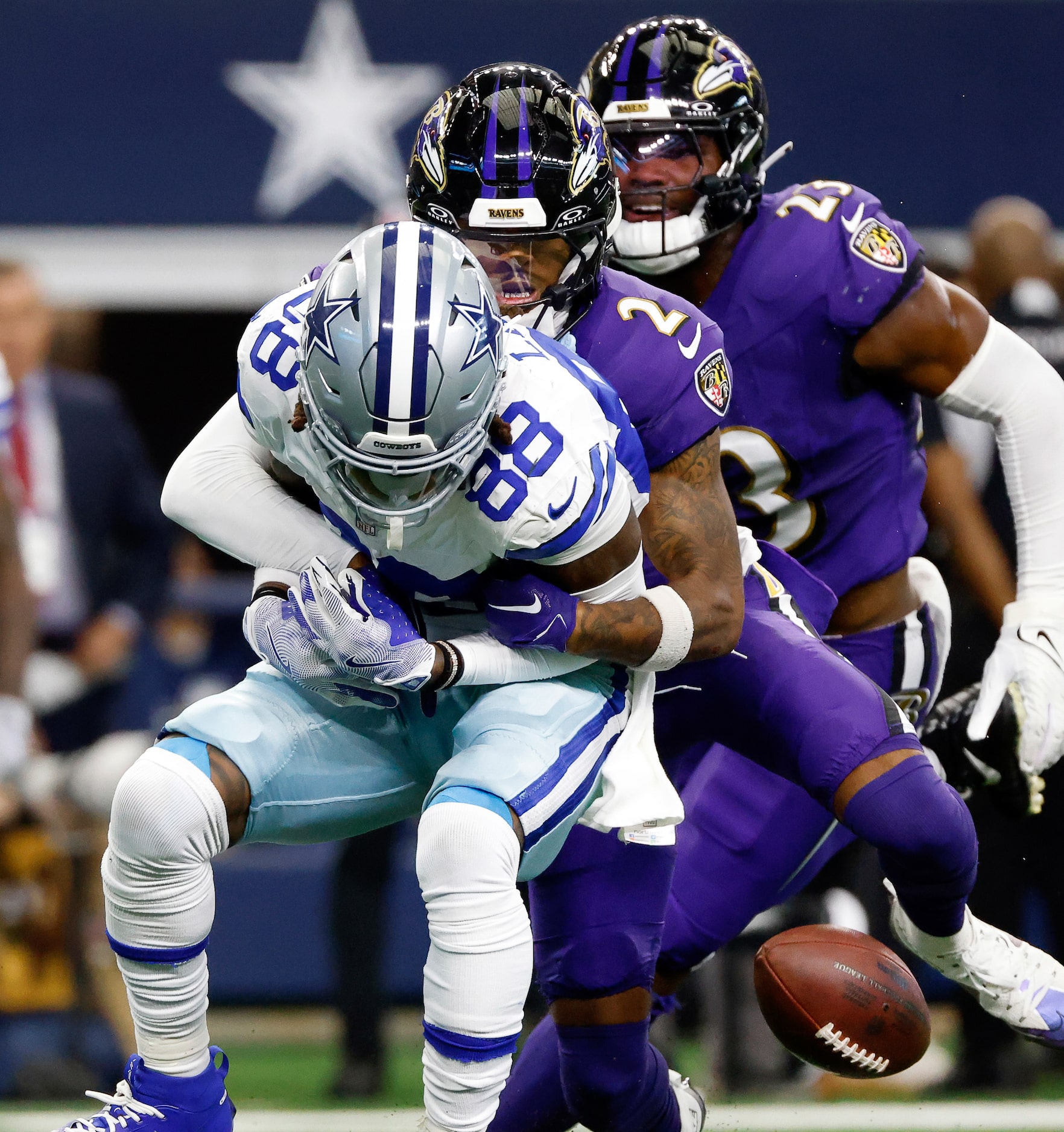 Dallas Cowboys wide receiver CeeDee Lamb (88) fumbles the ball as he’s tackled on a first...