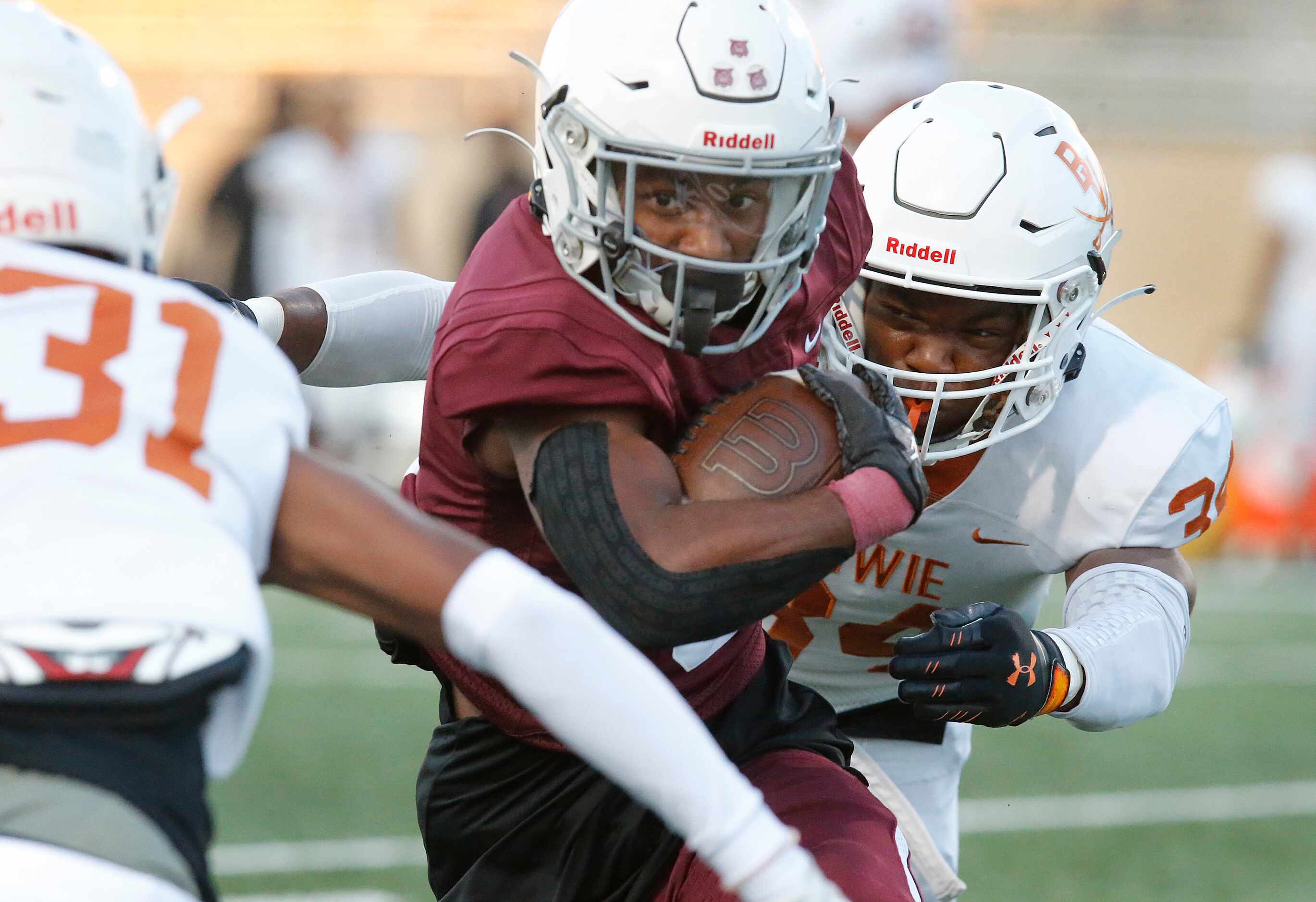 Plano Senior High School wide receiver Kavion Grady (3) finds himself looking for room...