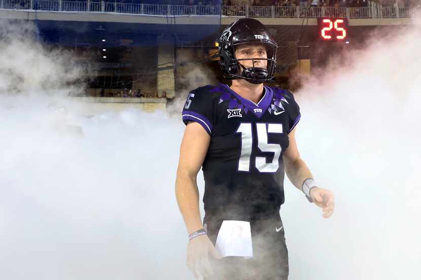 FILE - TCU quarterback Max Duggan (15) stands at a tunnel exit during team introductions...