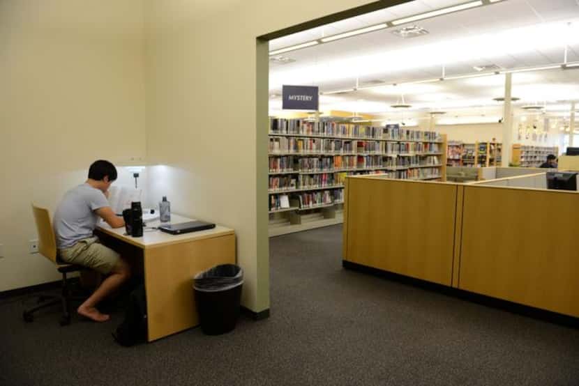 
Mark Han works at a desk in a corner space of the Hebron and Josey library. The remodel...