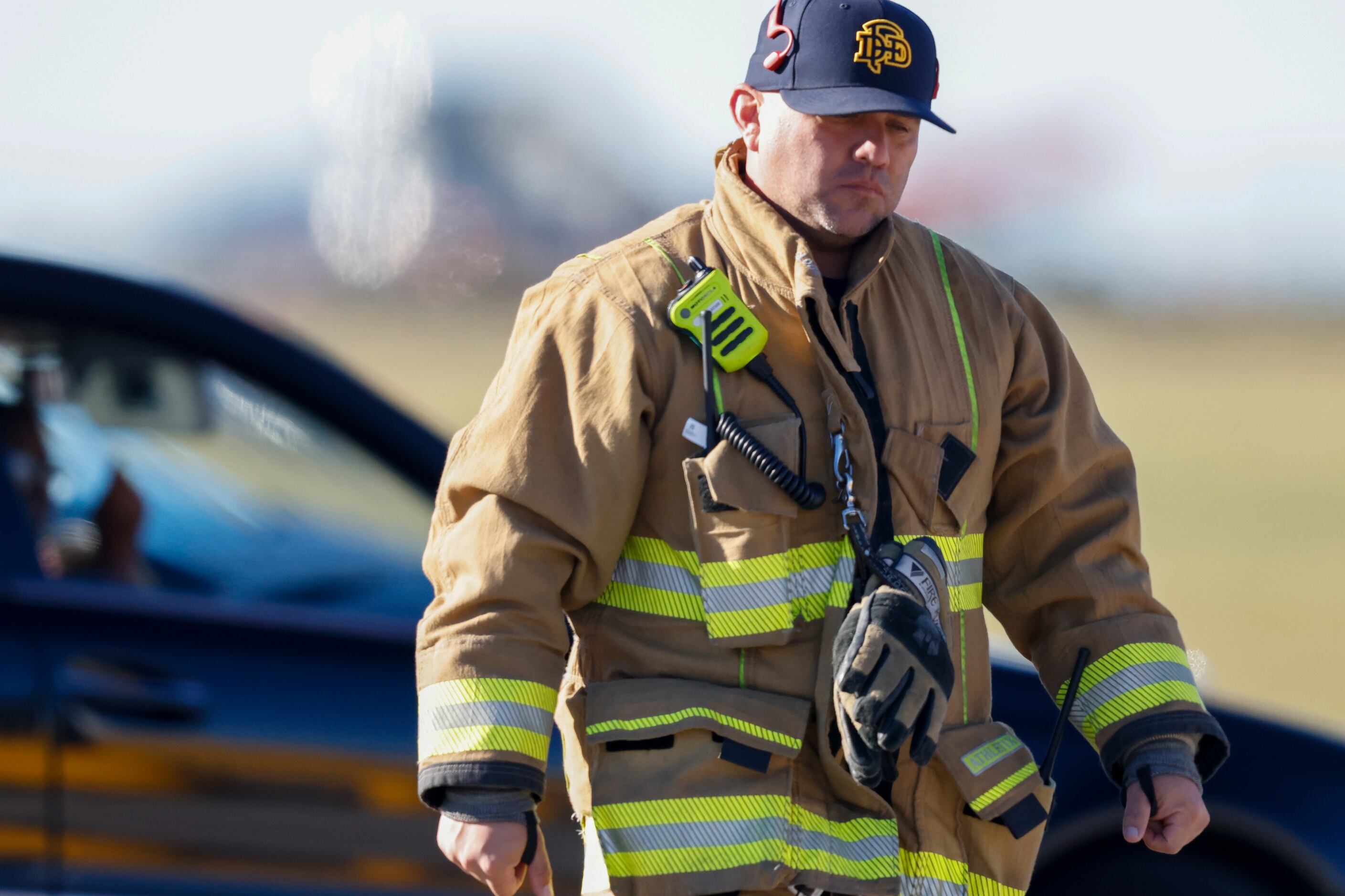 Fire and police respond to a mid-air collision between two planes within the fence line of...