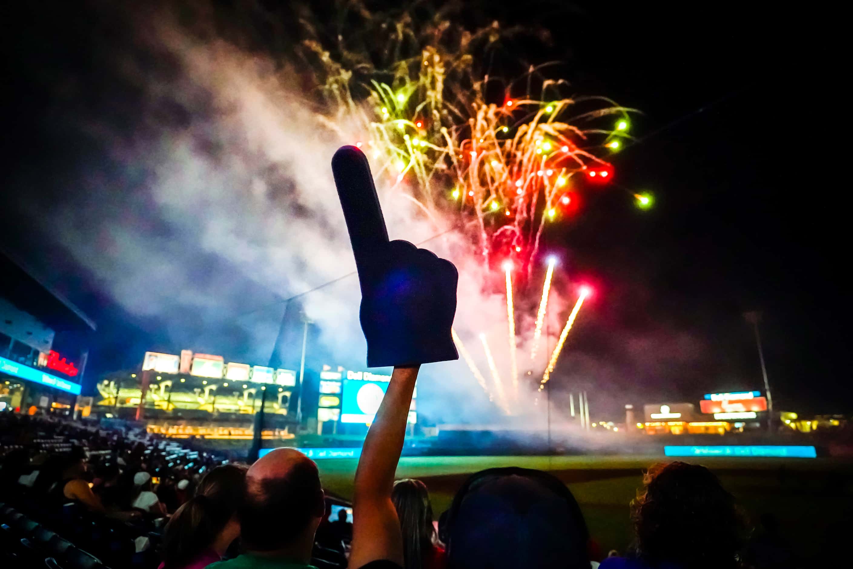 A fan waves a foam finger during fireworks after a 6-0 Round Rock Express victory over the...