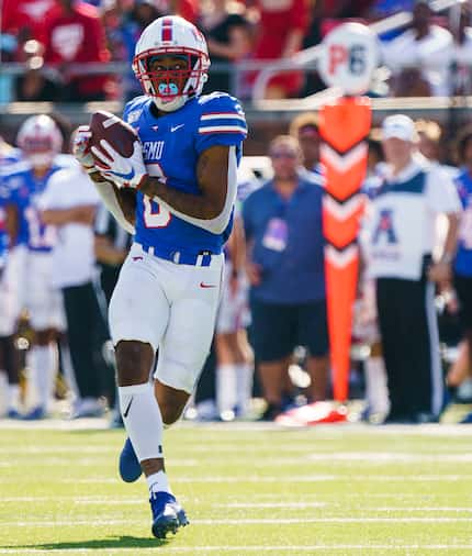 FILE - SMU wide receiver Reggie Roberson Jr. (8) hauls in a 75-yard touchdown pass from...