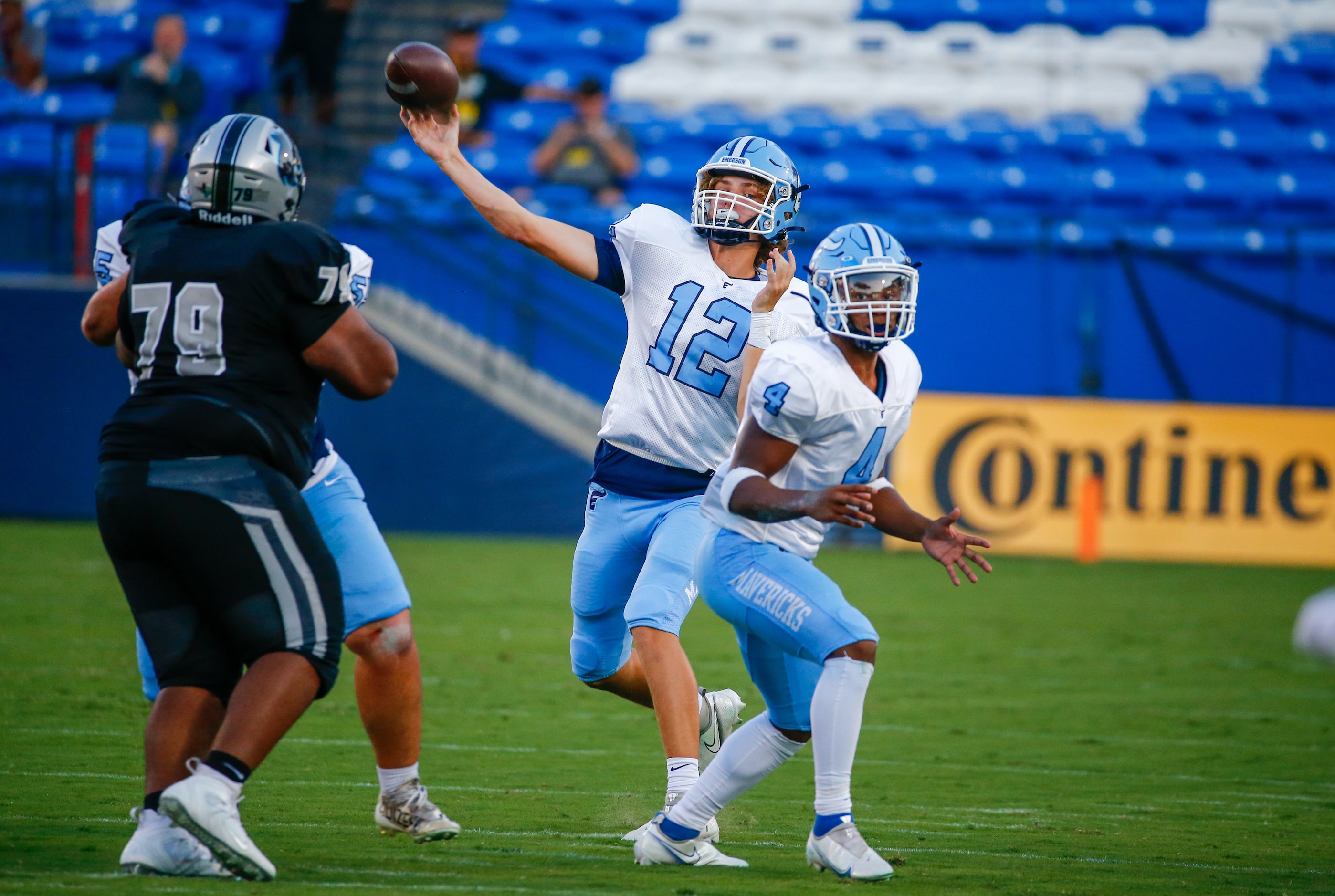 Emerson Mavericks quarterback Mike Molstad (12)throws a pass through Panther Creek Panthers...