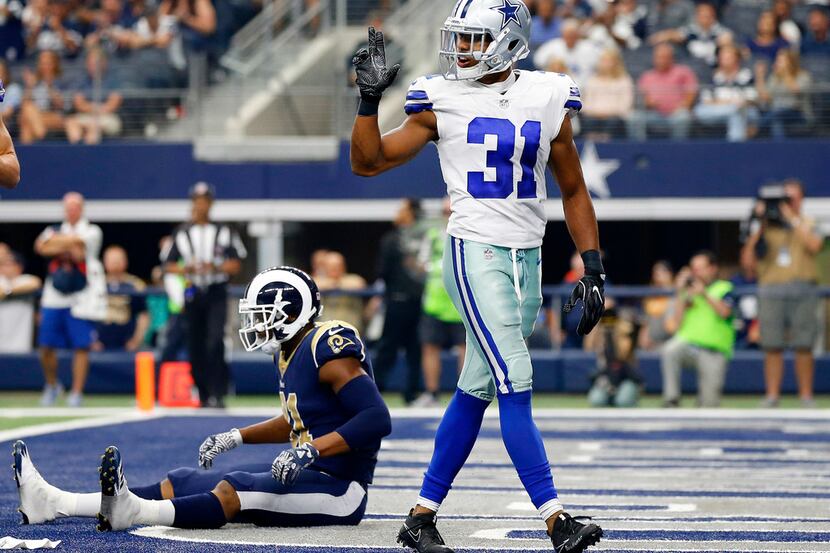 Dallas Cowboys free safety Byron Jones (31) breaks up a pass intended for Los Angeles Rams...