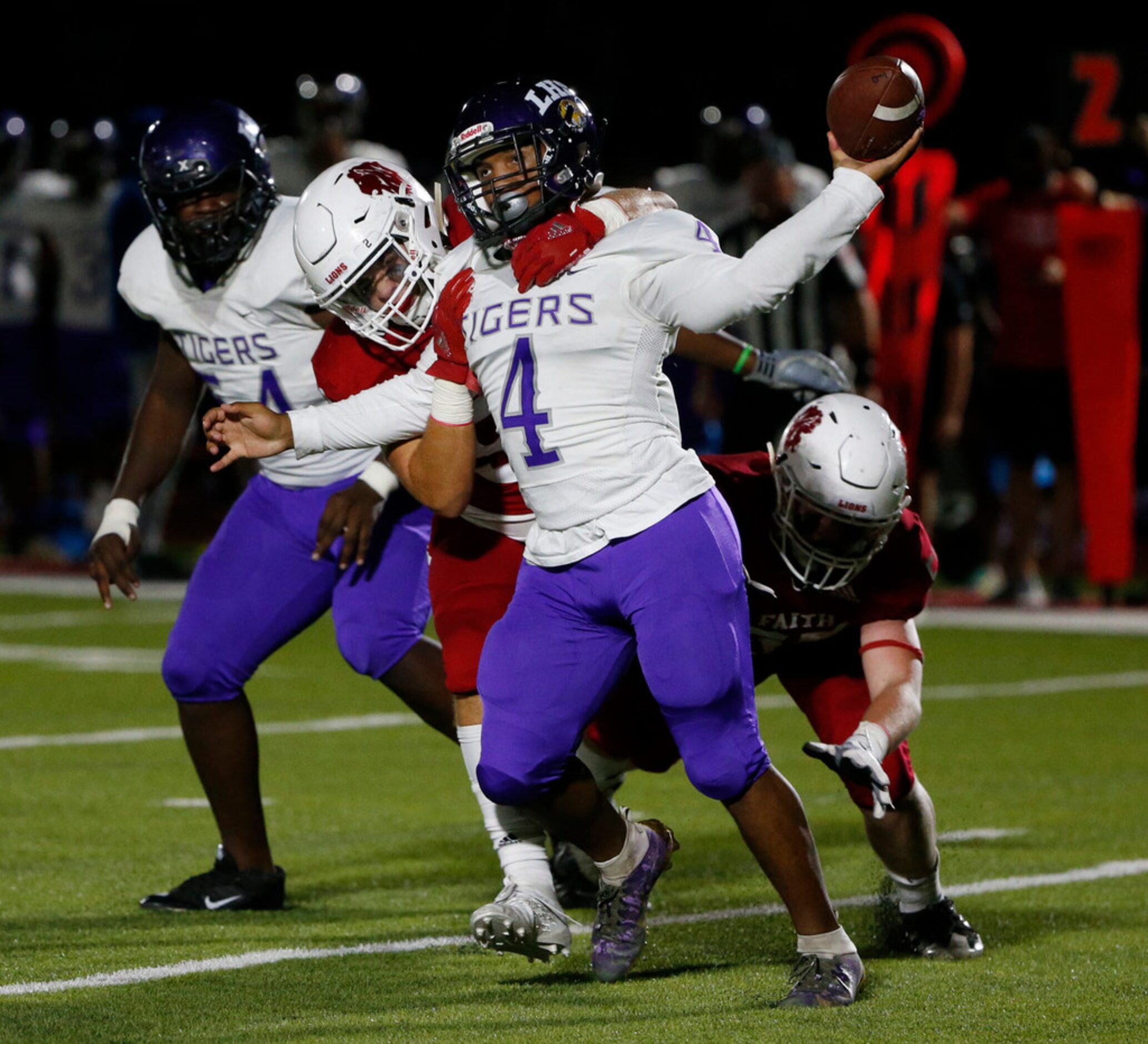 Lincoln's Travelle Gunels (4) is sacked by Grapevine Faith Christian's Preston Parkhill (52)...