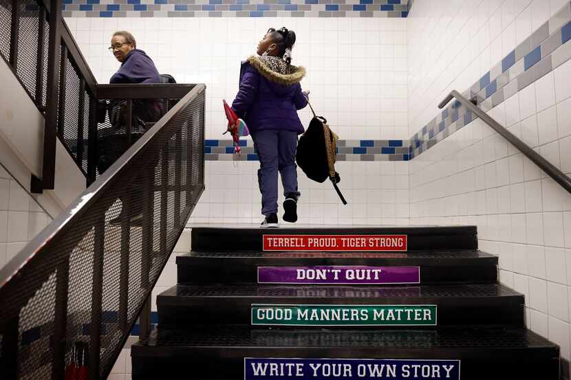 The stairs at Gilbert Willie Sr. Elementary school in Terrell ISD are marked with advice...