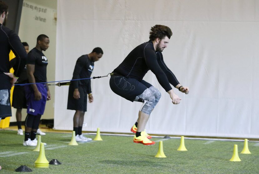 Connor McGovern, offensive lineman from the University of Missouri leaps in an exercise...