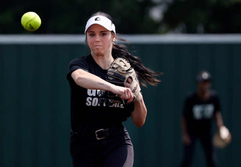 Denton Guyer softball player Kaylynn Jones turns a throw to third base during practice in...