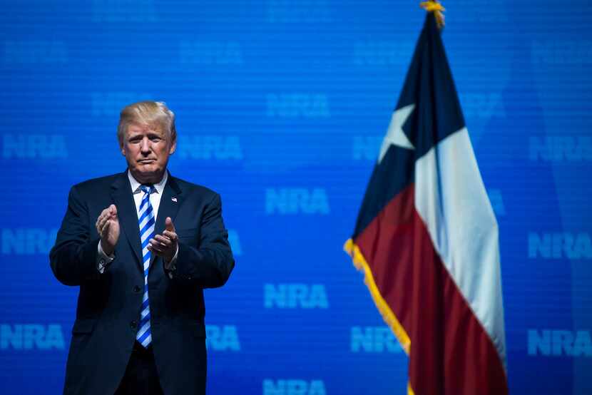 President Donald Trump applauds the crowd after addressing the NRA Annual Meeting at the Kay...