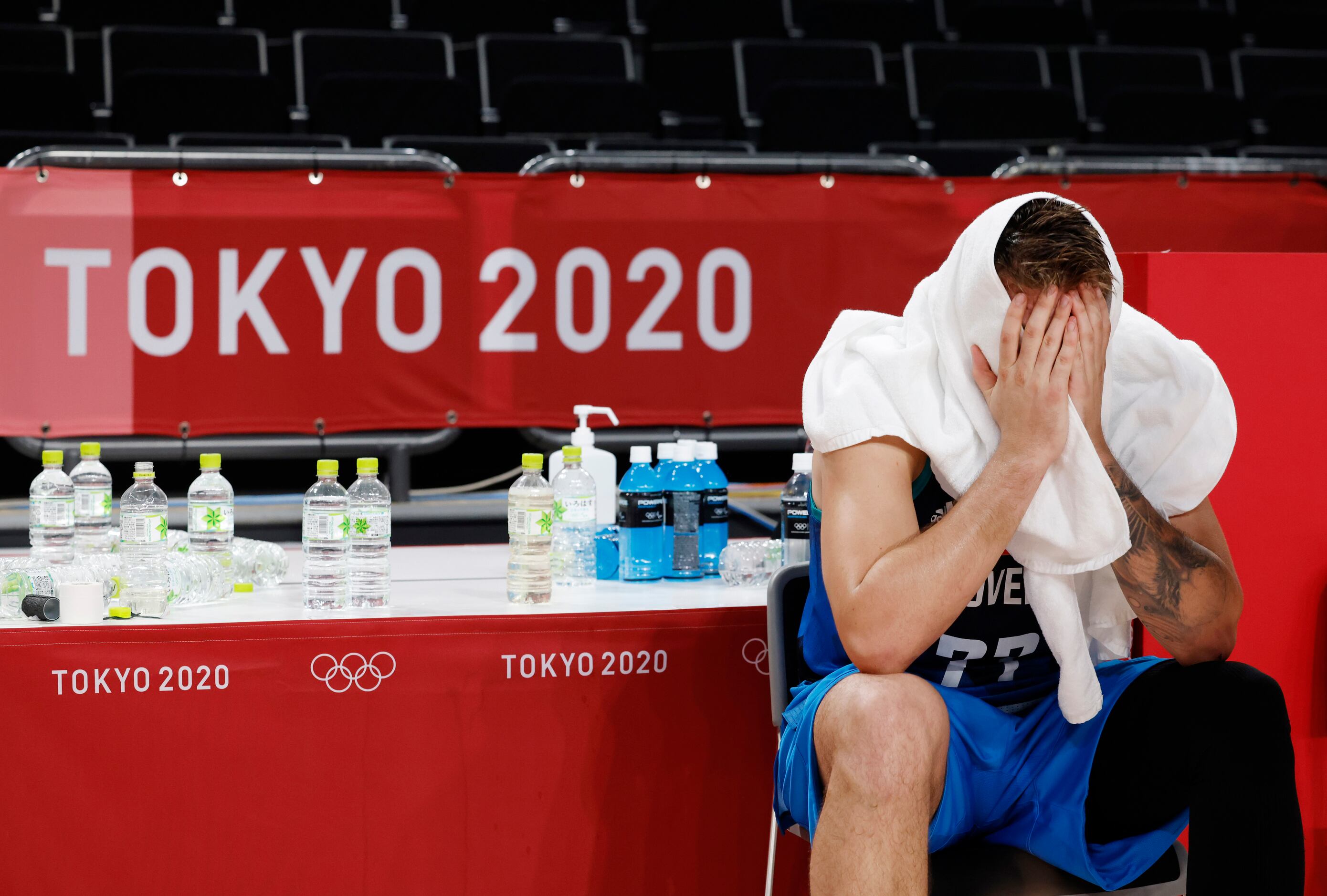 Slovenia’s Luka Doncic (77) sits dejected after losing to France 90-89 in a men’s basketball...