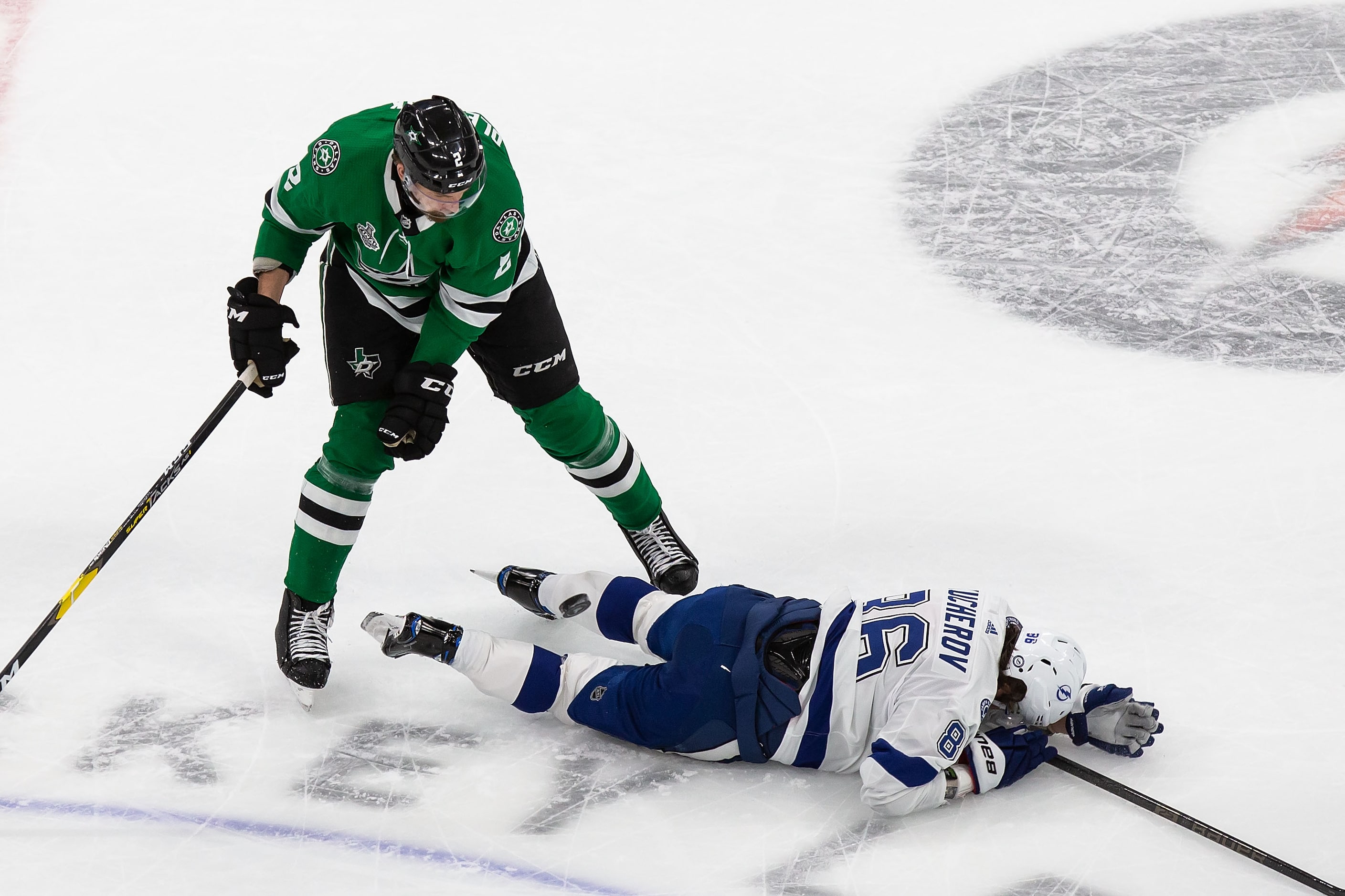 Jamie Oleksiak (2) of the Dallas Stars battles against Nikita Kucherov (86) of the Tampa Bay...