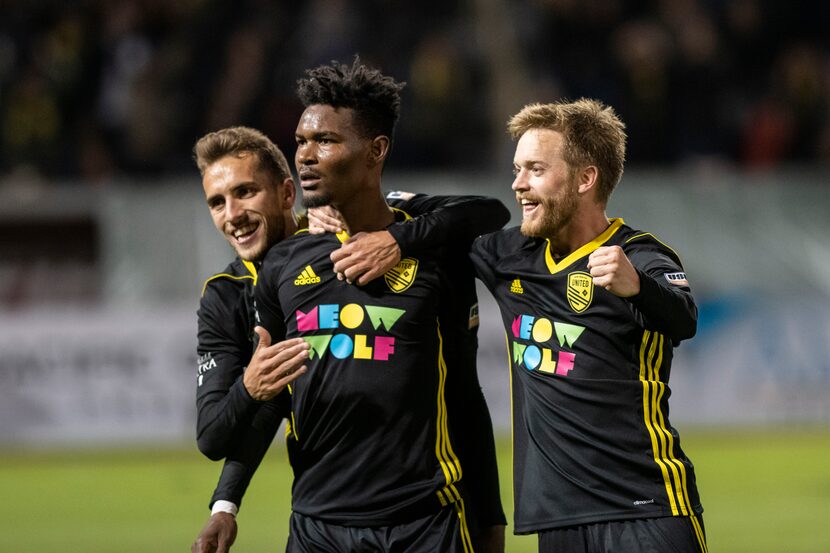 New Mexico United's Santiago Moar and Chris Wehan celebrate a goal scored by Kevaughn Frater