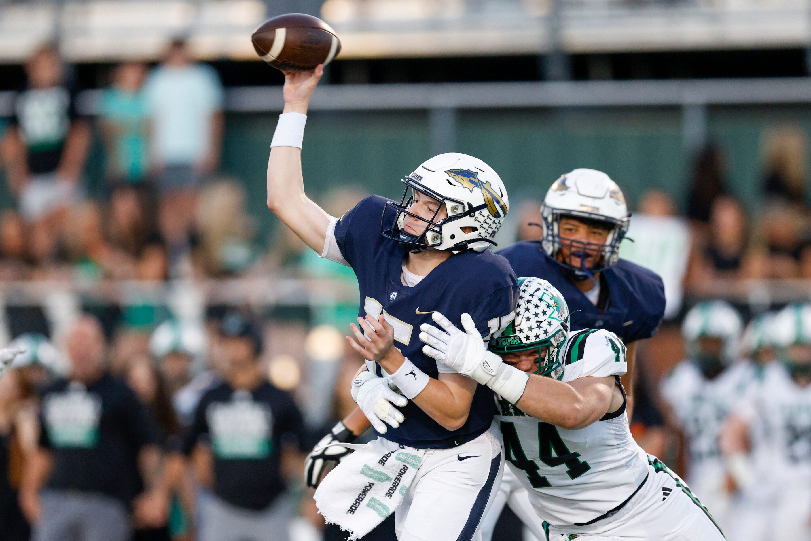 Southlake Carroll defensive lineman Dustan Mark (44) hits Keller quarterback Beckham...