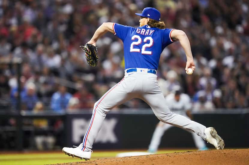 Texas Rangers relief pitcher Jon Gray throws during the fourth inning in Game 3 of the World...