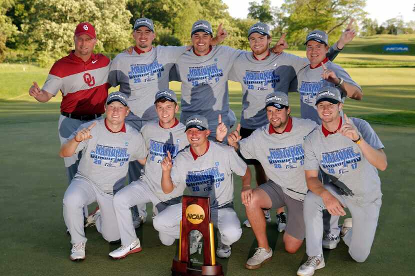 The Oklahoma men's golf team pose with the NCAA Division I Men's Golf Championships trophy...