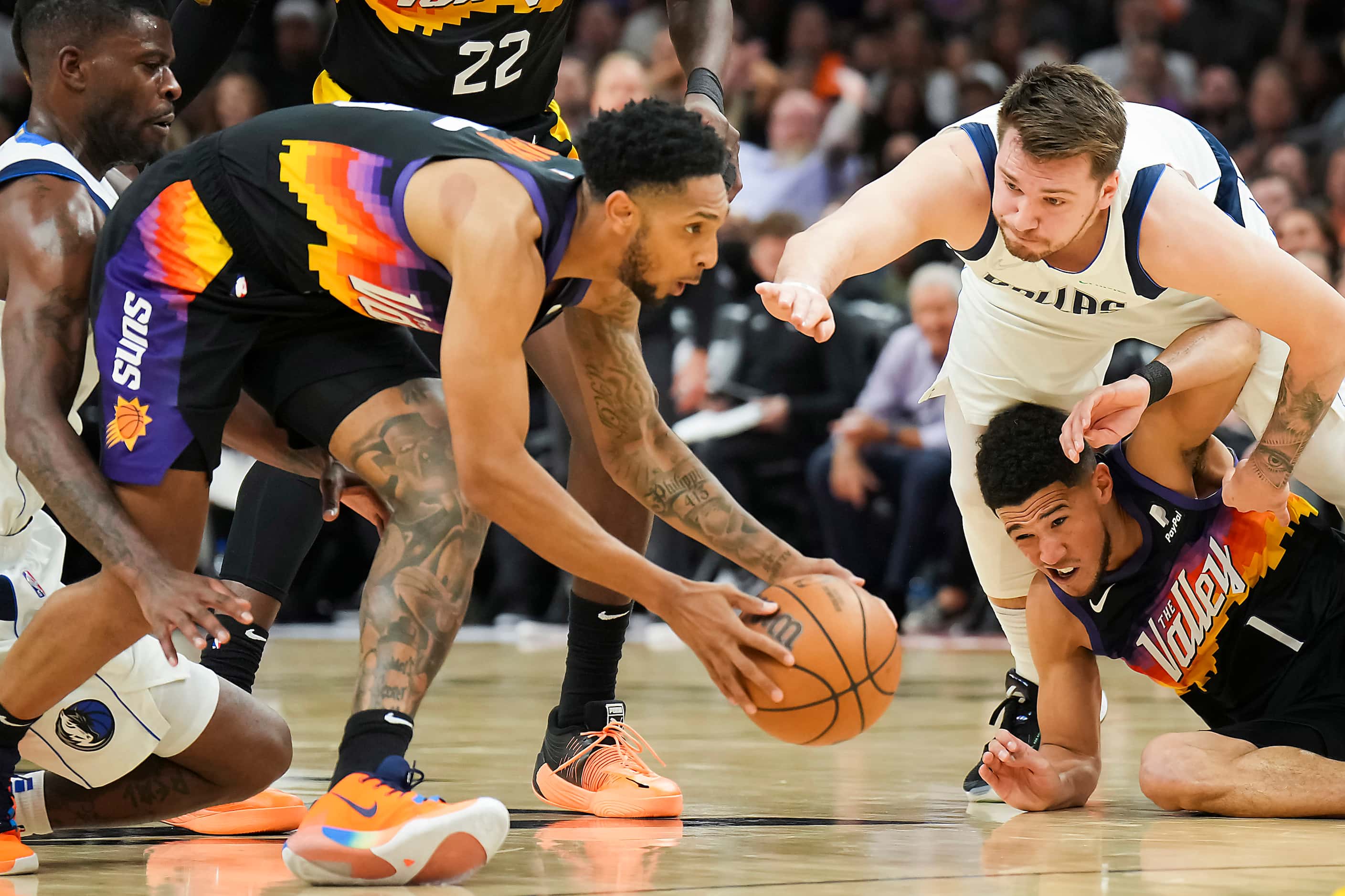 Phoenix Suns guard Cameron Payne (15) grabs a loose ball as Dallas Mavericks guard Luka...
