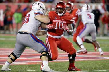 FILE - This Oct. 7, 2017 file photo shows SMU offensive lineman Evan Brown (63) trying to...