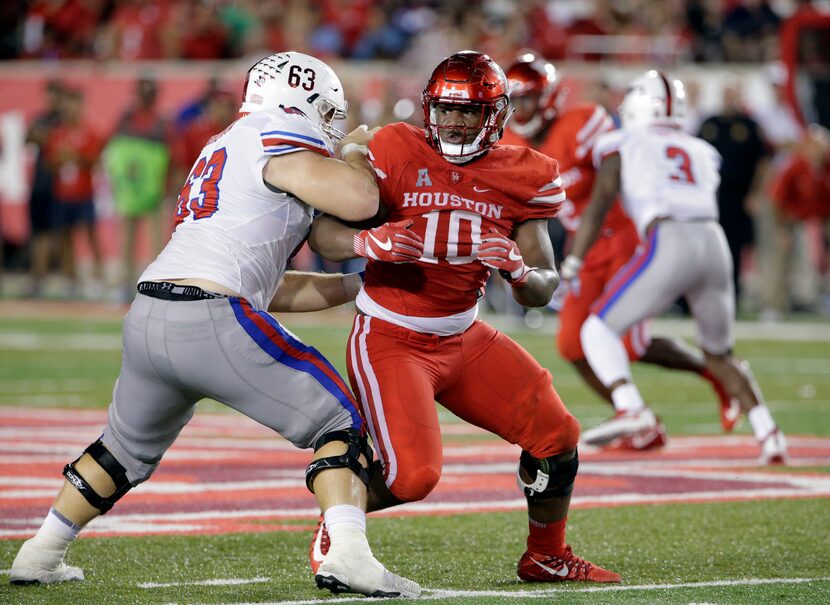 FILE - This Oct. 7, 2017 file photo shows SMU offensive lineman Evan Brown (63) trying to...