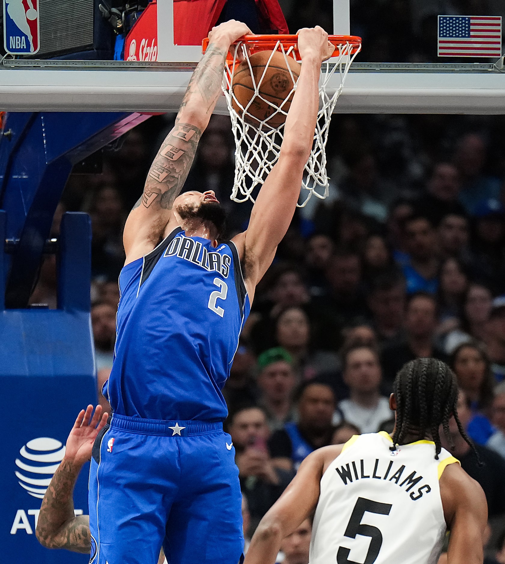 Dallas Mavericks center Dereck Lively II (2) slams home a reverse dunk past Utah Jazz...