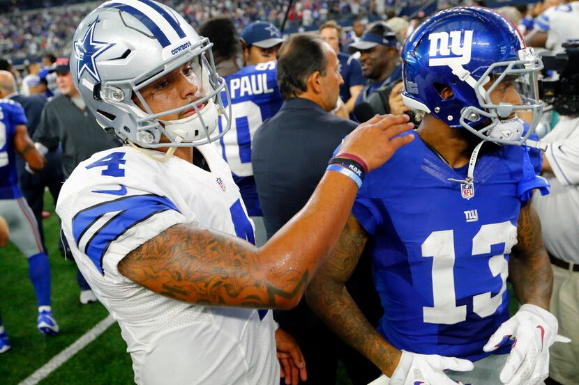 Dallas Cowboys quarterback Dak Prescott (4) congratulates New York Giants wide receiver...