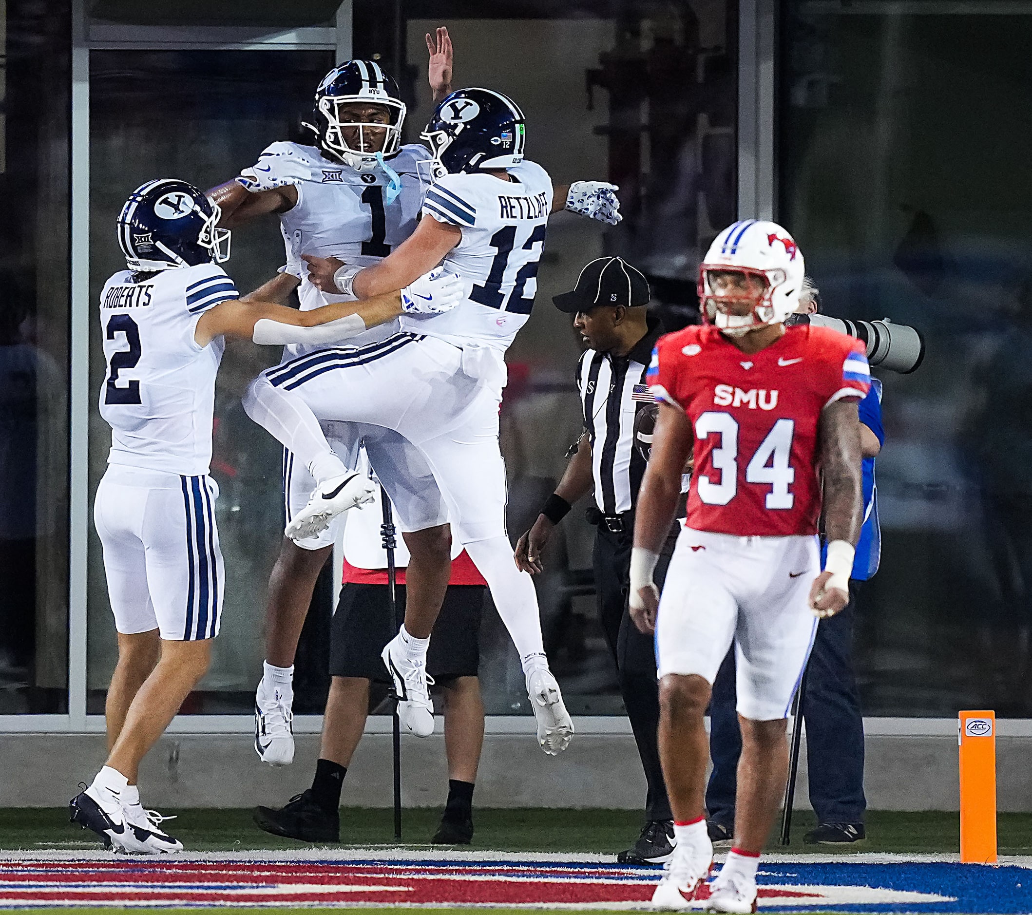 BYU’s Keanu Hill (1) celebrates with Jake Retzlaff (12) after connecting on a two-point...