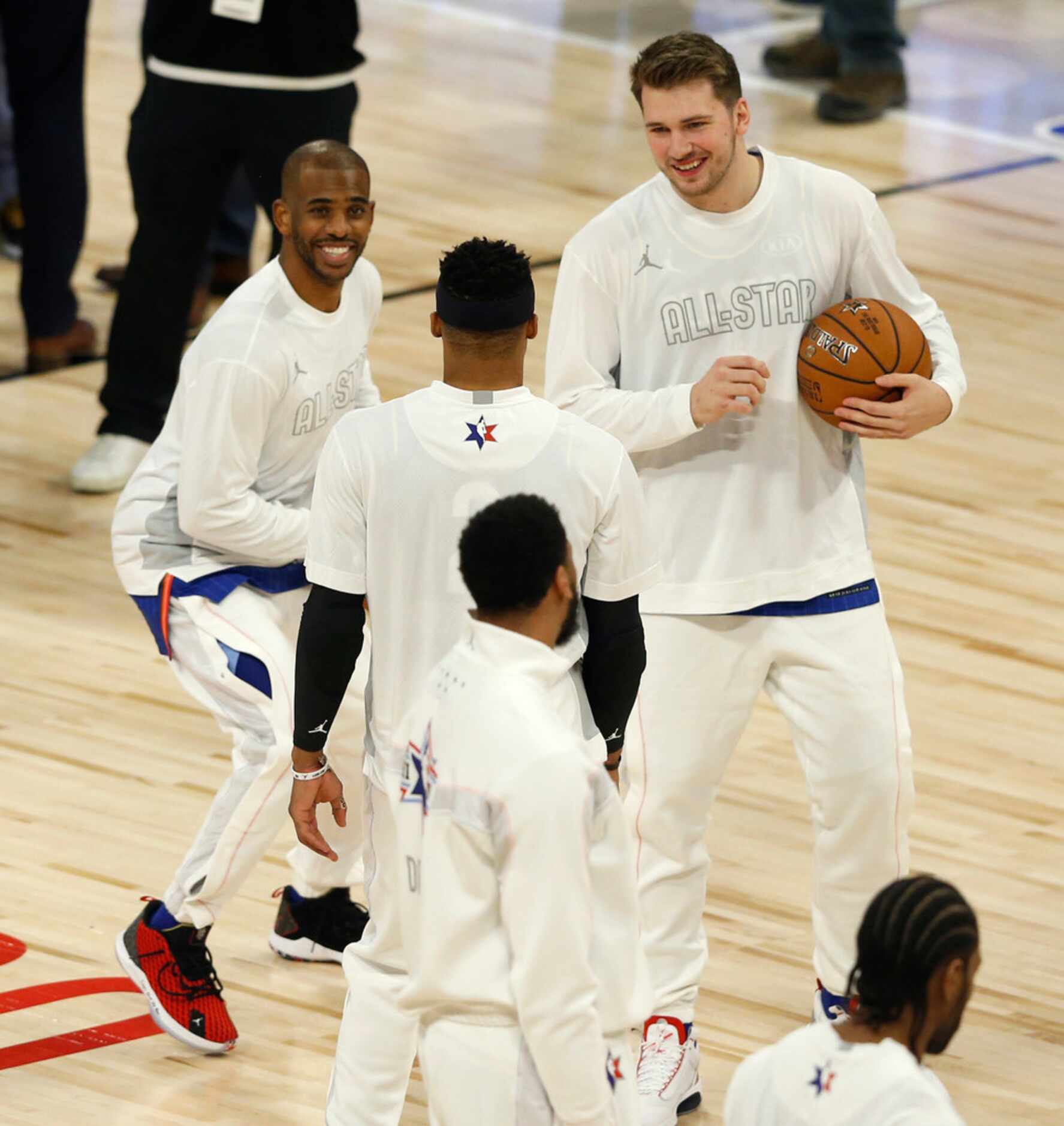 Team LeBron's Chris Paul (2) imitates Luka Doncic's step back technique in front of Doncic...