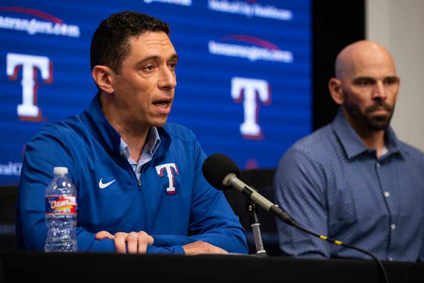 Texas Rangers President of Baseball Operations Jon Daniels answers questions next to Manager...