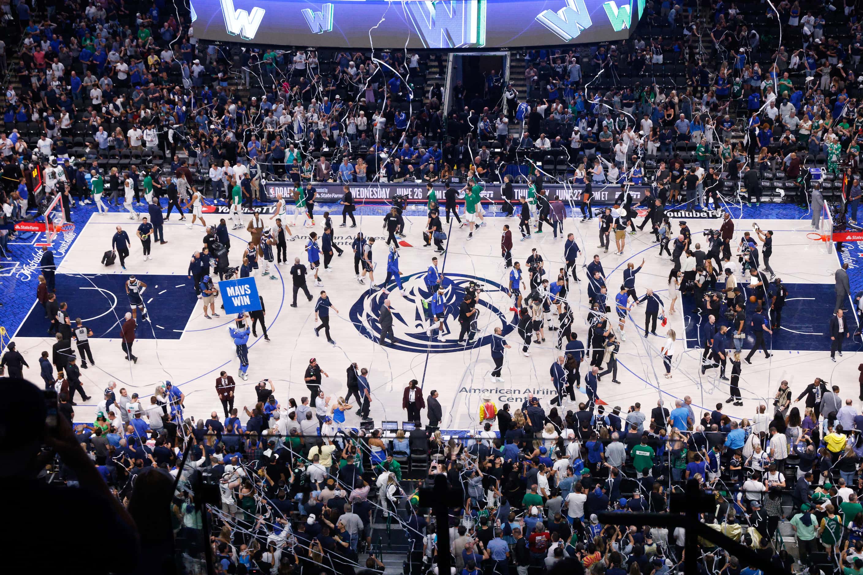 Streamers fall from the rafters after the Dallas Mavericks defeated the Boston Celtics in...