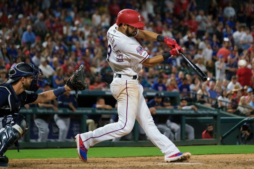 Texas Rangers third baseman Isiah Kiner-Falefa connects to drive in the winning run with a...