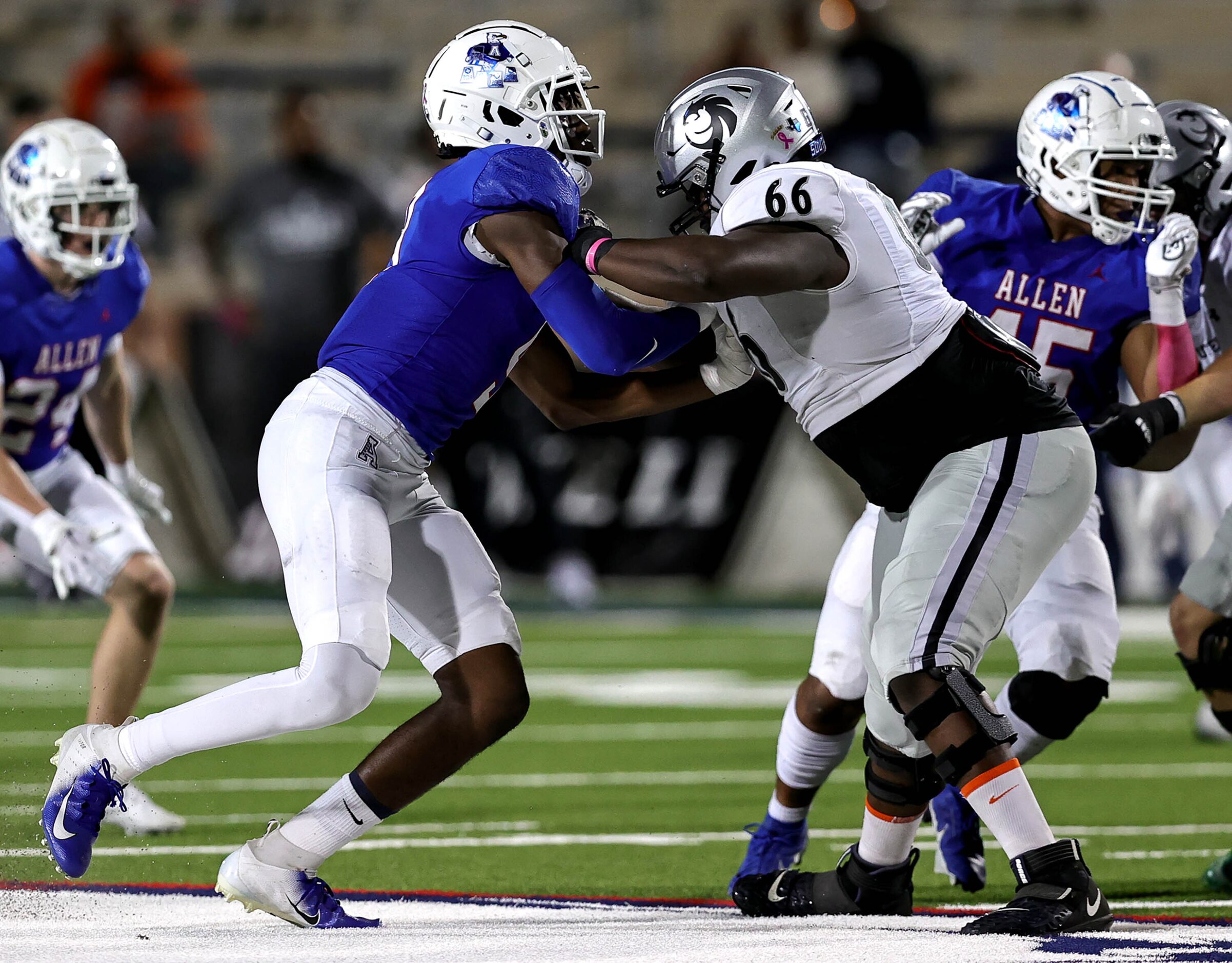 Allen defensive lineman Zina Umeozulu (left) tries to pass rush against Denton Guyer...