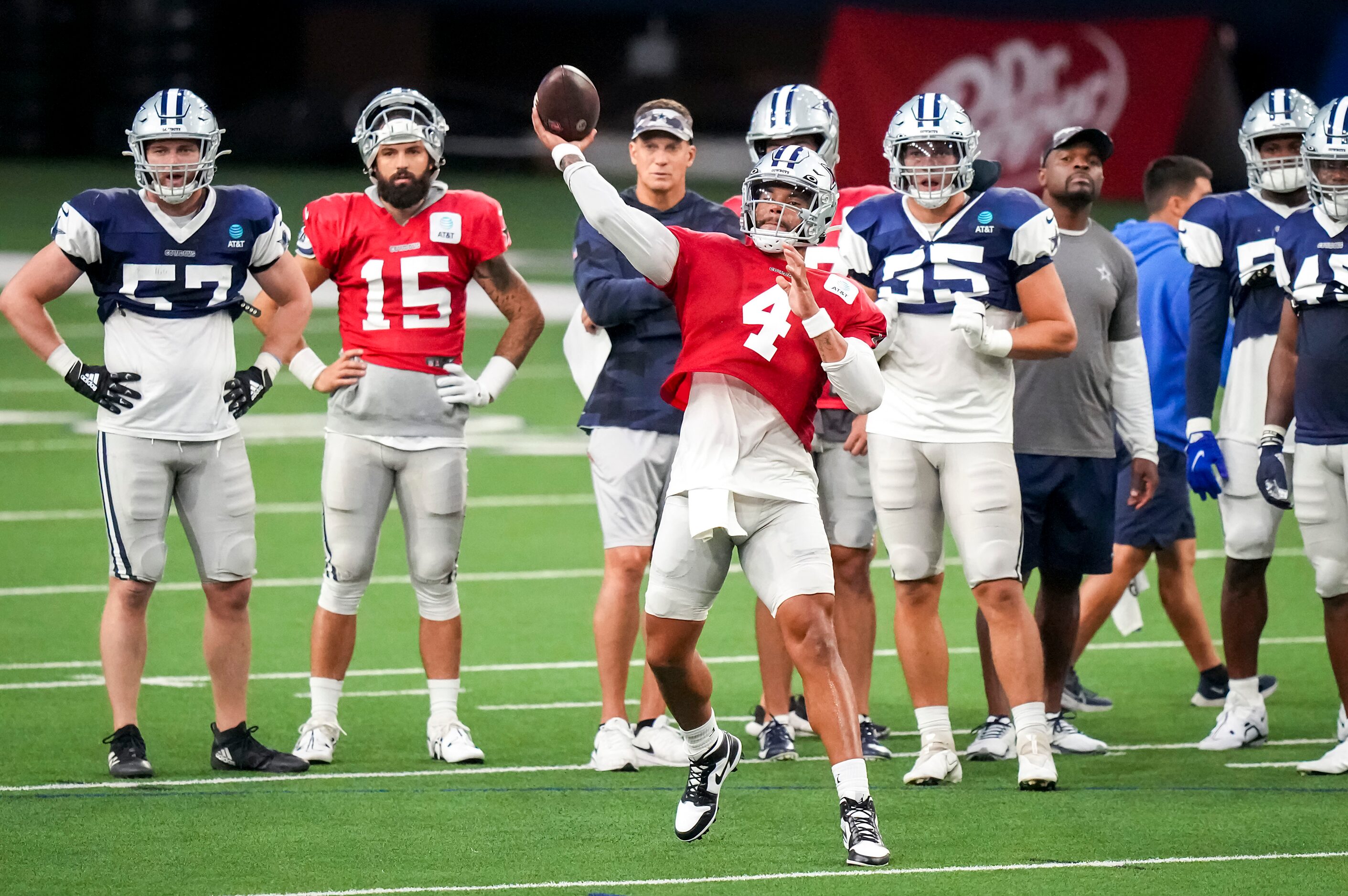 Dallas Cowboys quarterback Dak Prescott (4) throws a pass as linebacker Luke Gifford (57),...