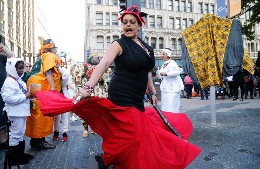 Princess Lalegba La Ogun Exuniki Yomi Lashone Baker-Law of Dallas dances during the Libation...