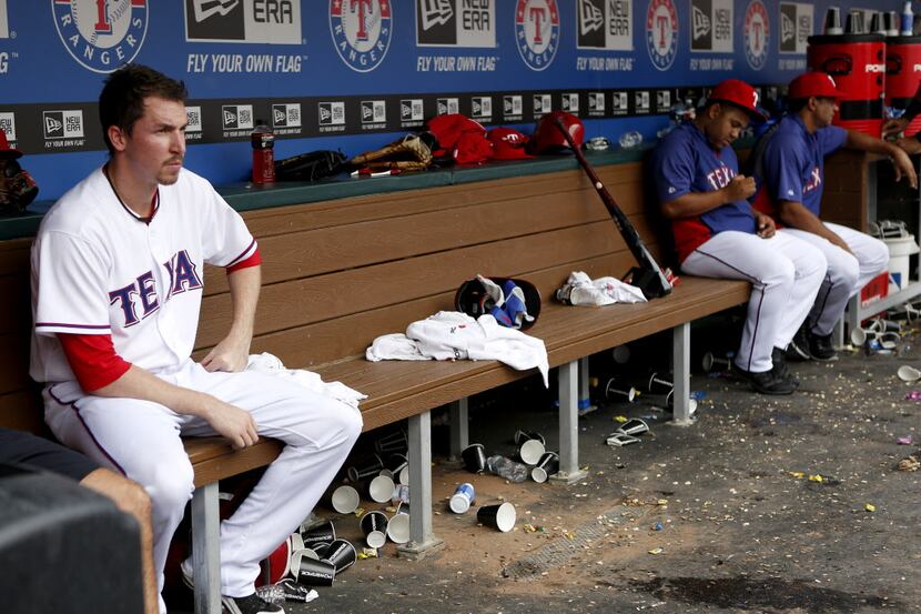Tanner Scheppers sits on the bench during the last inning of the Rangers vs, Pittsburgh...