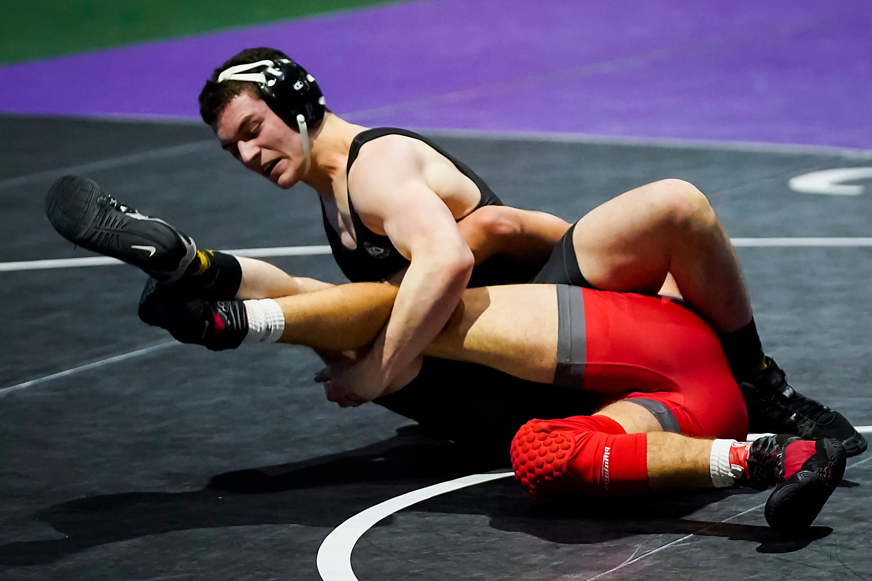 John Richardson of Prosper (top) wrestles Austin Hartmangruber of San Antonio Lee for the 6A...